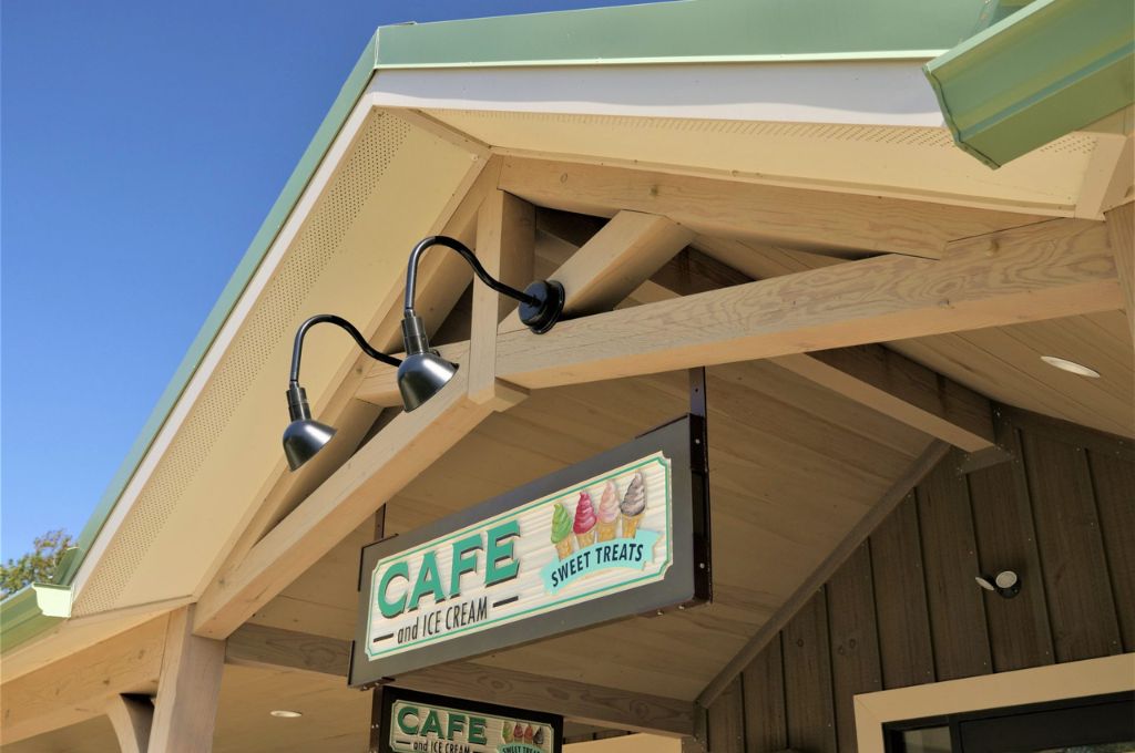 commercial building type for retail space featuring post frame outdoor entryway with ice cream shop sign